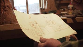 An Artisan Skillfully Creating a Highly Detailed Sketch for Wood Carving Projects. Stock Clip video