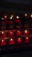 The Warm Glow of Red Candles in a Calm and Serene Setting Creates an Enchanting Atmosphere video