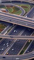aéreo Visão do a urbano rodovia intercâmbio cercado de exuberante vegetação e natureza video