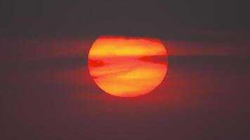 Big red sun setting. Evening sky, clouds, sunset view, and cloudy sky video