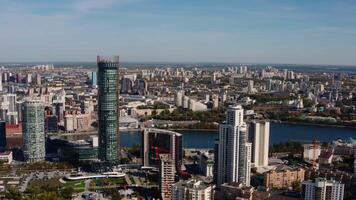 A big city with an embankment and a river. Stock footage. Bird's-eye view of tall office and residential buildings in the Art Nouveau style and the embankment for tourist walks. video