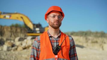 Portrait of builder in uniform at construction site video