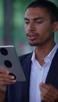An Engaged and Focused Professional Utilizing a Tablet for Effective Communication in Business video