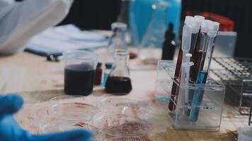A person in a lab coat is working on a project video