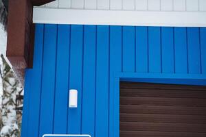 There is a striking blue building prominently displaying a sign indicating that no parking is allowed in the vicinity of the structure, ensuring a clear message for visitors photo