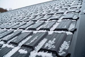 This image features a detailed closeup view of a roof that is adorned with a thick, soft layer of fresh snow, significantly enhancing its charming and picturesque winter appearance photo