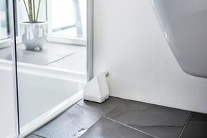 Modern bathroom with smart water sensor device for leak detection and prevention photo
