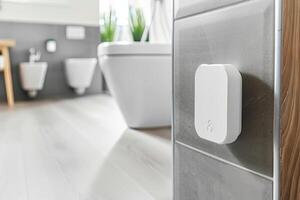 Modern bathroom with smart water sensor for leak detection and prevention photo