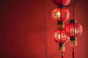 Traditional red lanterns on a rich crimson background photo