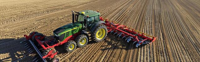 Modern tractor plowing a field in autumn for efficient soil preparation photo