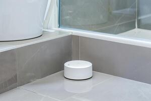 Modern bathroom with smart wireless speaker for home automation and relaxation photo