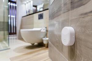 Modern bathroom design featuring smart air freshener device for enhanced comfort and hygiene photo