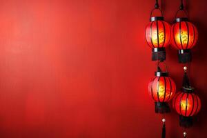Red lanterns on a vibrant red wall, celebrating chinese new year photo