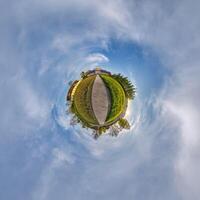A small planet with a path and grass photo