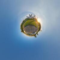 A small planet with a small building in the middle photo