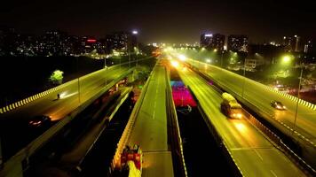 Aerial night view of illuminated highway and bridges video