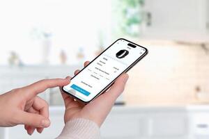 Smartphone screen displaying a purchase confirmation for a smartwatch. A hand taps 'Confirm Payment,' with credit card details and product image visible photo