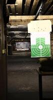 shooting range suspended green target view of a 50-meter underground range. Perfect for capturing the precision and thrill of shooting sports enthusiasts looking the depth intensity of target practice photo