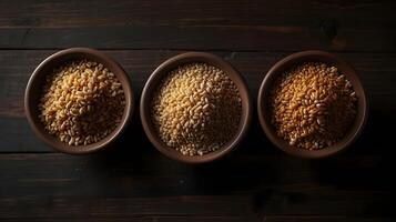 Rustic Ceramic Bowls with Ancient Grains Like Quinoa, Farro, and Amaranth on Dark Wooden Table photo