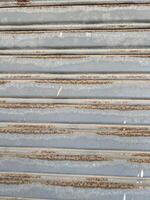 metal texture with scratches and cracks which can be used as a background photo