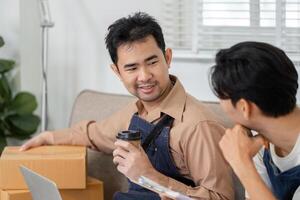 Young delivery professional sharing ideas while holding coffee and discussing strategies with a coworker photo