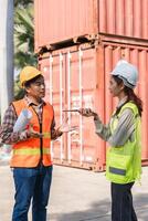 Construction engineer discussing project specifications professionals communicating effectively on-site photo