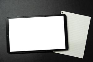 Blank screen tablet on desk. digital tablet with empty display. photo