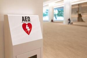 Automated External Defibrillator sign AED machine with instructions on the walkway. copy space. photo