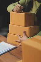 A woman is holding a stack of boxes photo