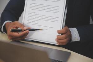 A man signing a contract photo