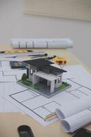A model of a house sitting on top of a table photo