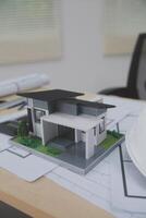 A model of a house on a table photo
