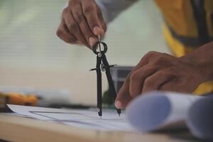 A person is using a pair of scissors to cut a piece of paper photo