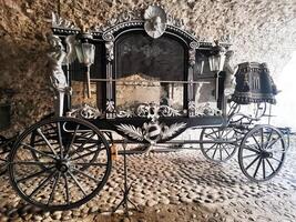 Rare royal carriage decorated with statues and decorative elements photo
