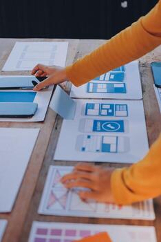 A person is working on a computer with a design on it photo