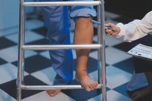 A doctor is examining a patient's leg photo