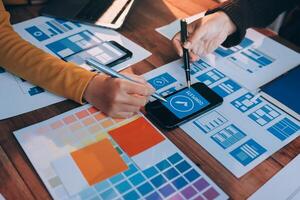 A person is using a smartphone to design a website photo