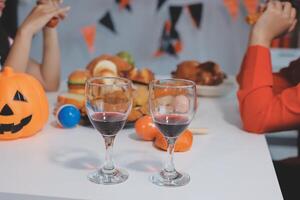 Two people sitting at a table with wine glasses photo