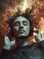 Young man enjoying music with headphones, immersed in a vibrant atmosphere photo