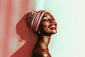 Smiling woman with a colorful headwrap radiating joy and confidence photo