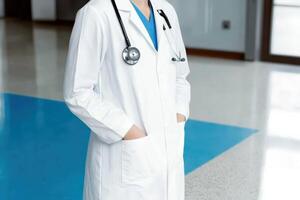 Doctor in a white coat with a stethoscope, ready for patient care photo
