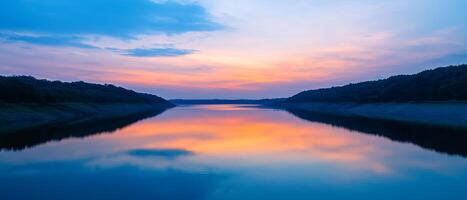 Burnout recovery mental concept. Serene sunset reflected on a calm river with gentle hills in the background. photo