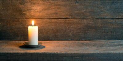 Burnout recovery mental concept. Candle glowing softly on a rustic wooden surface. photo