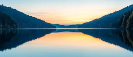 Burnout recovery mental concept. Serene lake reflecting mountains at sunset with calm waters. photo