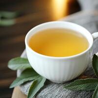 Burnout recovery mental concept. A delicate cup of herbal tea on a textured surface. photo