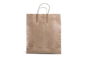 Brown paper bag with handles isolated on a white background photo