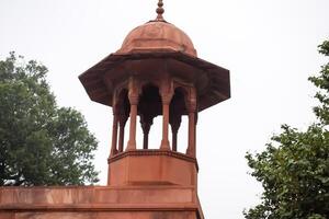 A red brick building with a dome on top photo