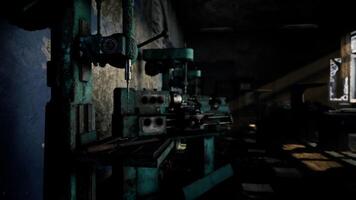 Old manufacturing workshop with tools and machines in low light ambience video