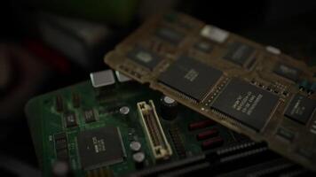 Close up of circuit boards and microchips on a workbench in a tech lab video