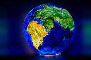 The globe is illuminated from the inside on a dark background photo